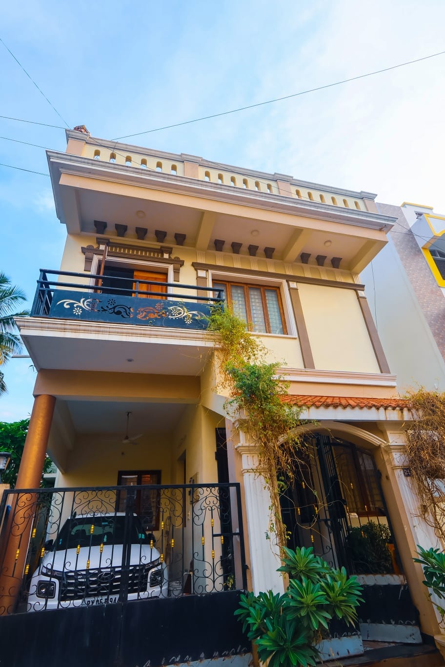 Mahesh House &mdash; front facade with balcony and covered porch