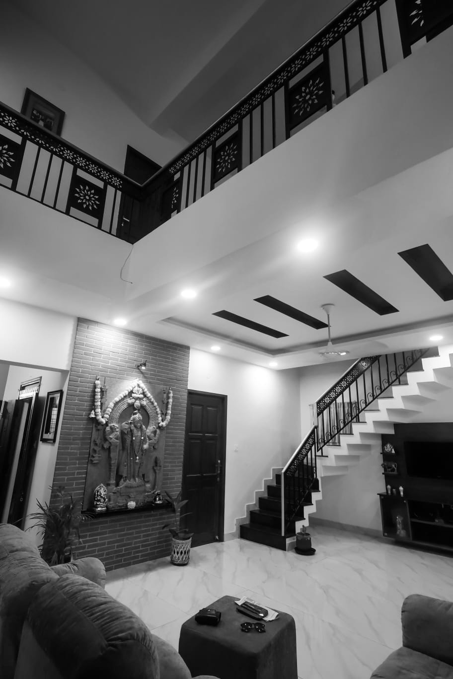 Mahesh House &mdash; staircase and living area with feature wall